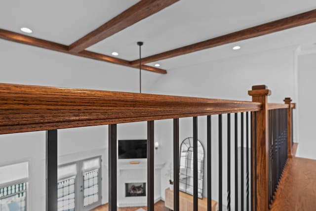 interior space with wood-type flooring and beamed ceiling