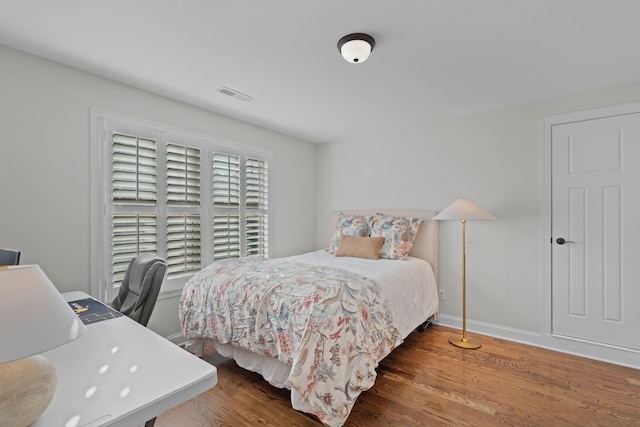 bedroom featuring dark hardwood / wood-style floors