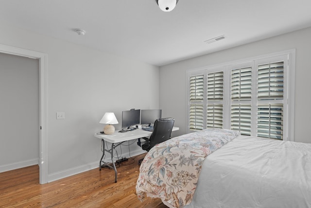 bedroom featuring hardwood / wood-style flooring