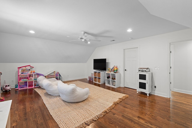 rec room featuring ceiling fan, vaulted ceiling, and dark hardwood / wood-style floors