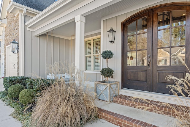 view of exterior entry featuring french doors