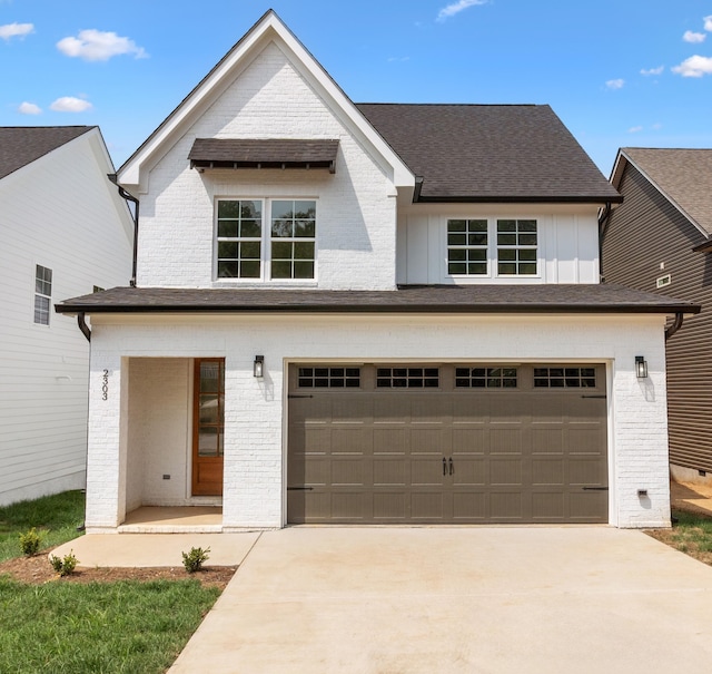 view of front facade featuring covered porch and a garage