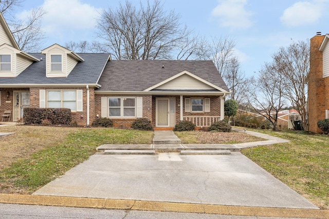 view of front of property with covered porch and a front lawn