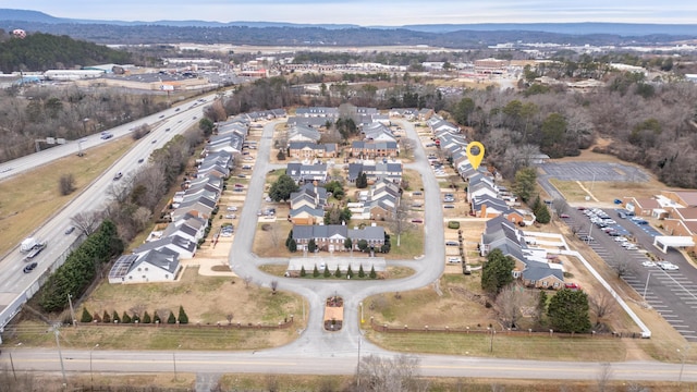 birds eye view of property with a mountain view