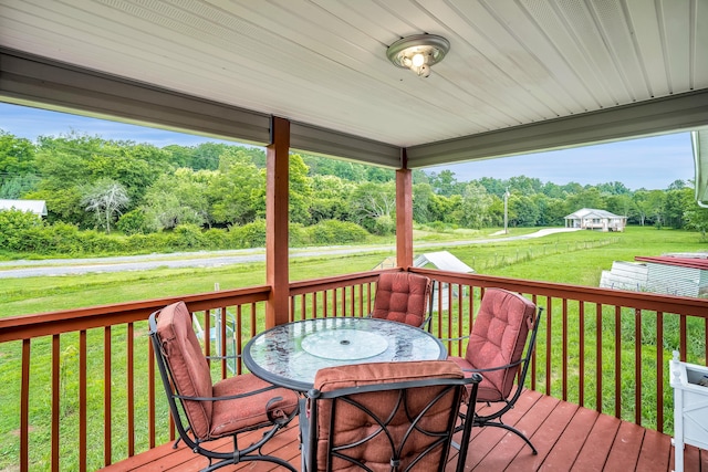 wooden deck with a yard