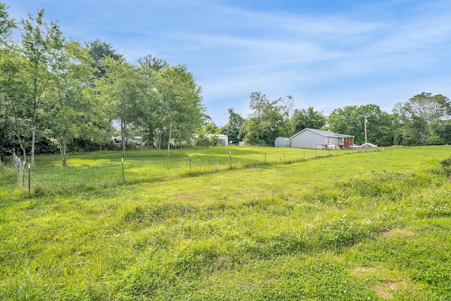 view of yard with a rural view