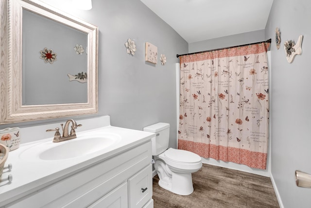 full bathroom with toilet, vanity, shower / bath combination with curtain, and hardwood / wood-style floors