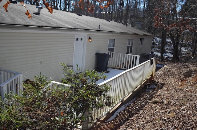 rear view of property with a wooden deck