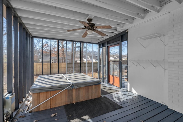 unfurnished sunroom with a jacuzzi