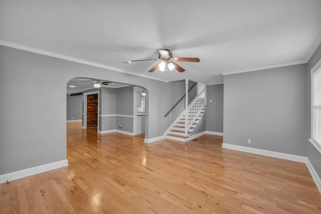 spare room with ceiling fan, light hardwood / wood-style flooring, and ornamental molding