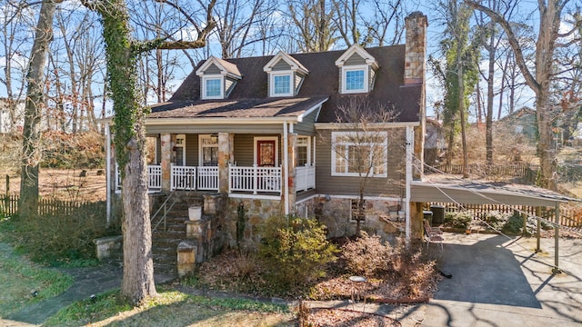 cape cod home with a carport and covered porch