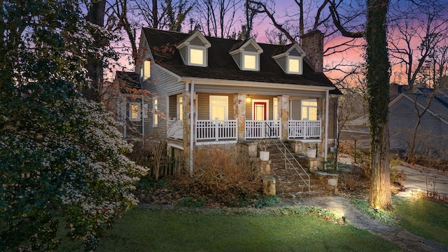 cape cod house with a porch