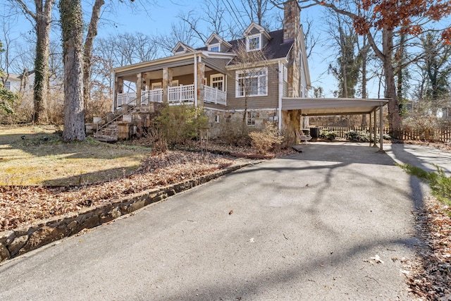 view of front facade with a carport and a porch