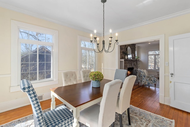 dining area with crown molding and a healthy amount of sunlight