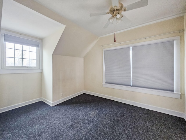 bonus room with carpet floors, ceiling fan, and vaulted ceiling