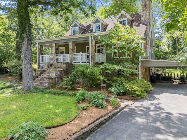 608 Texas Ave, Signal Mountain, TN 37377 - cape cod home featuring a porch, a carport, asphalt driveway, a front lawn, and stairs