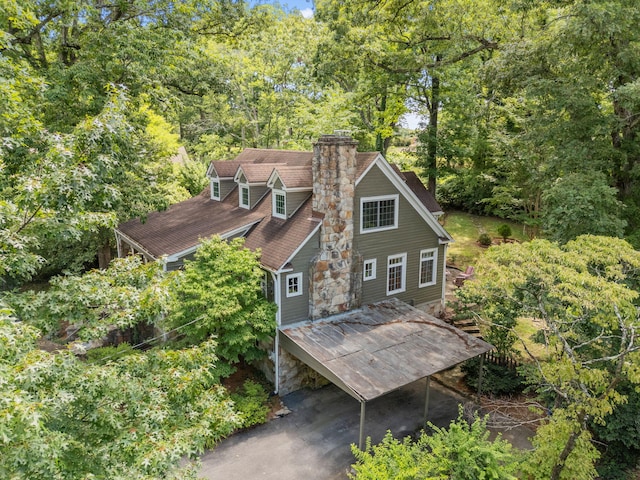 608 Texas Ave, Signal Mountain, TN 37377 - rear view of house with a chimney, a wooded view, and a shingled roof