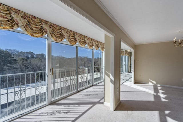 sunroom featuring an inviting chandelier