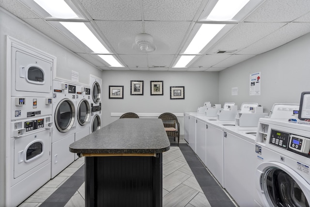 washroom with stacked washer / dryer and washer and dryer