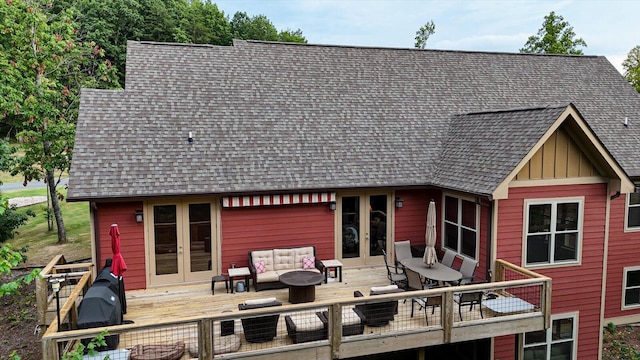 rear view of house featuring an outdoor hangout area, a wooden deck, and french doors