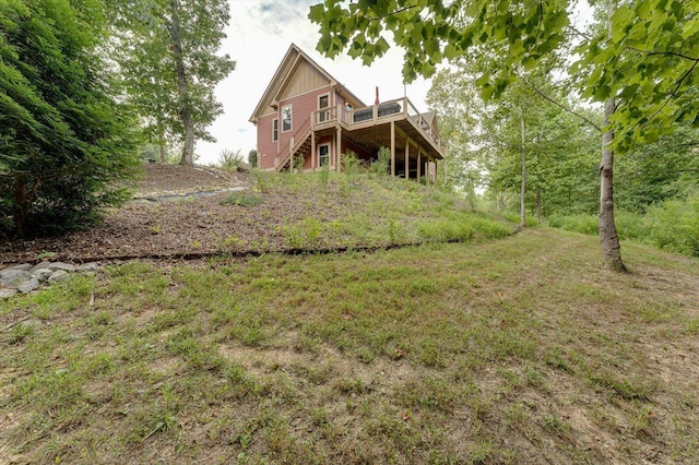 back of property featuring a deck