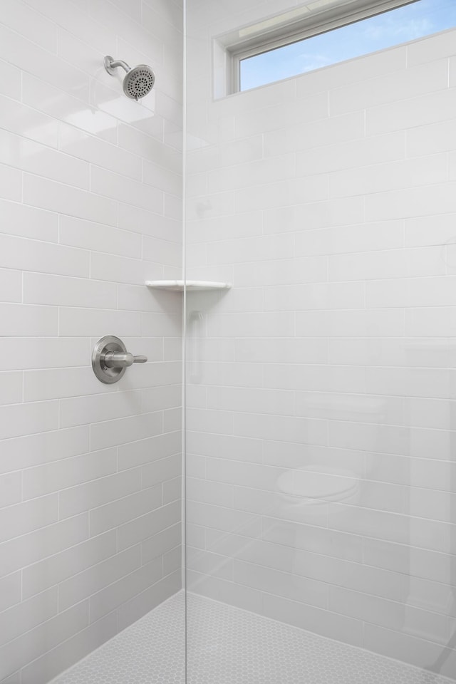 bathroom with a tile shower