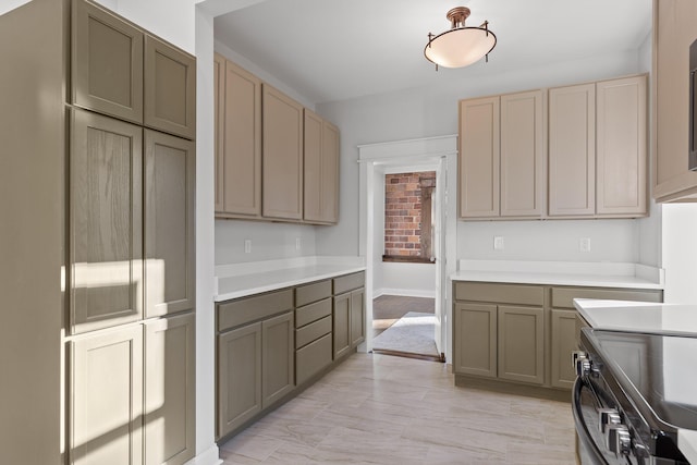 kitchen with light brown cabinets and stainless steel electric range oven