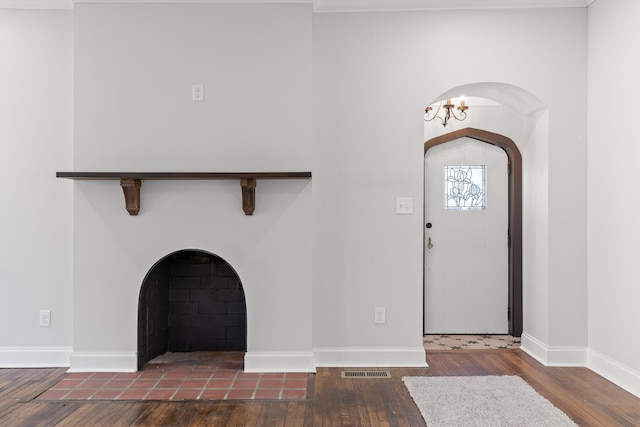 foyer entrance with dark wood-type flooring