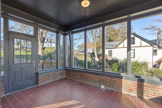 unfurnished sunroom featuring a healthy amount of sunlight