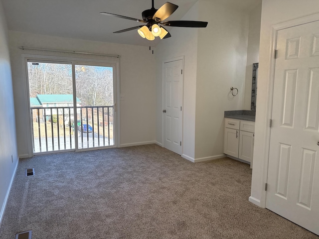 interior space with ceiling fan