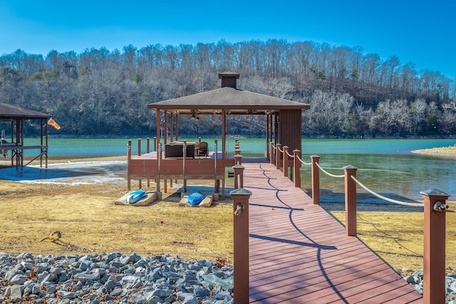 dock area featuring a gazebo and a water view