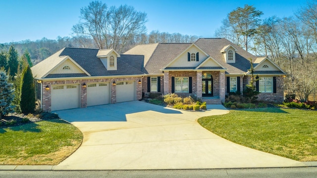 craftsman-style home with a garage and a front yard