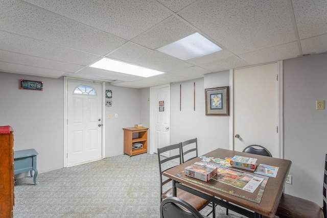 dining area featuring a drop ceiling