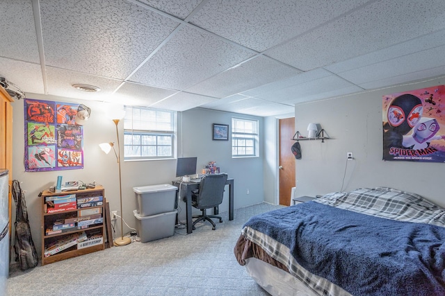 bedroom with a paneled ceiling