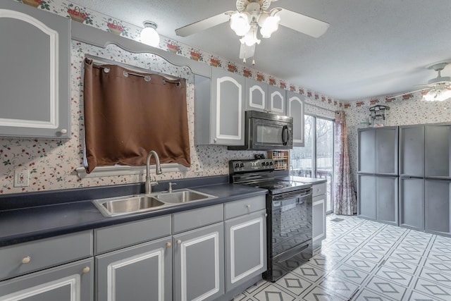 kitchen featuring sink, black appliances, a textured ceiling, ceiling fan, and white cabinets