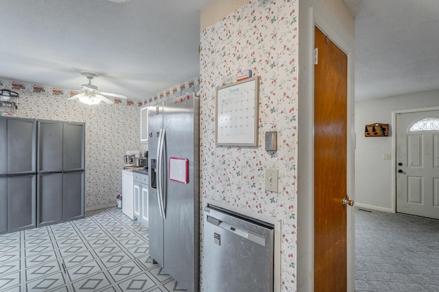 kitchen with stainless steel fridge with ice dispenser, a textured ceiling, and ceiling fan