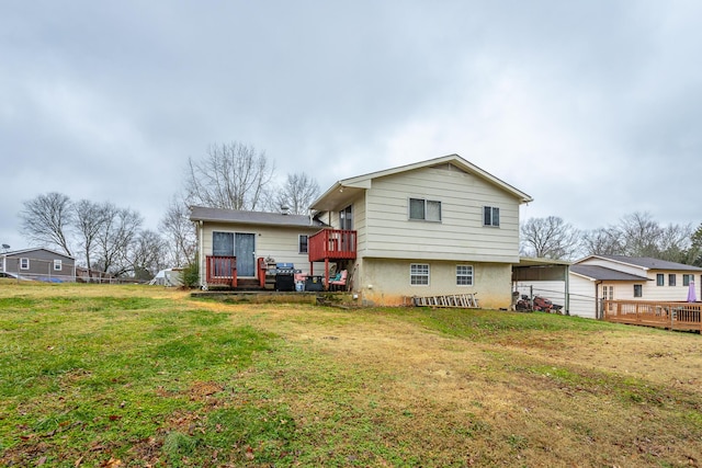 back of property with a yard and a deck