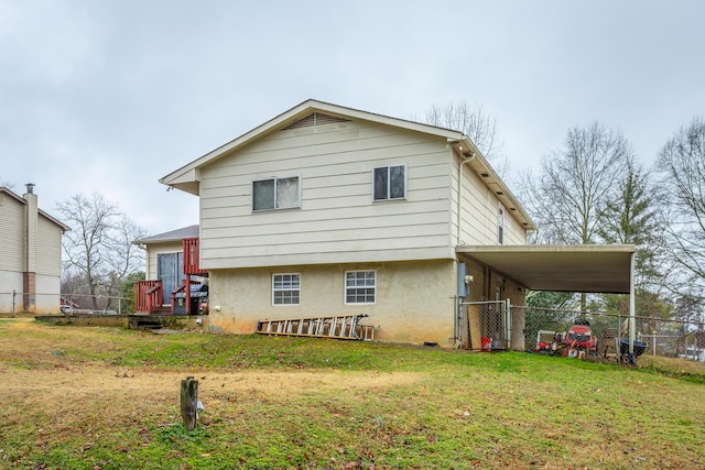 rear view of property with a yard