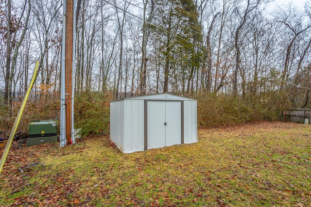 view of outbuilding with a yard