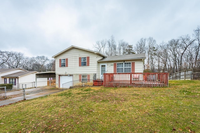 tri-level home with a carport, a garage, and a front yard