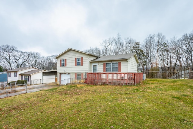 view of front of home with a garage, a deck, and a front lawn