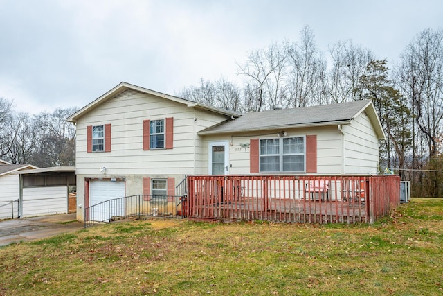 split level home featuring a garage and a front lawn