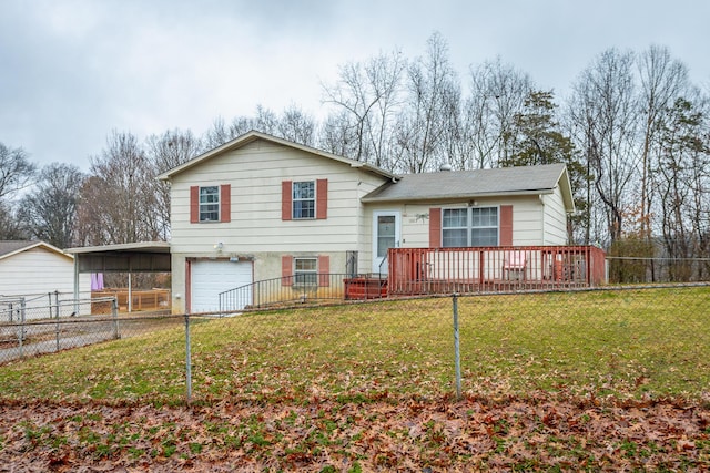 tri-level home with a garage, a carport, a wooden deck, and a front yard