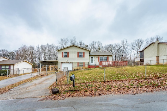 view of front of property featuring a garage, a front yard, and a carport