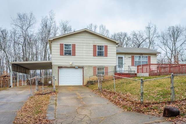 tri-level home with a garage and a front yard