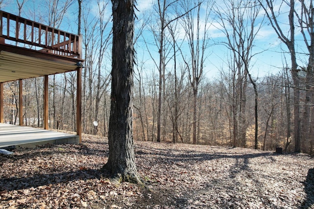 view of yard with a wooden deck