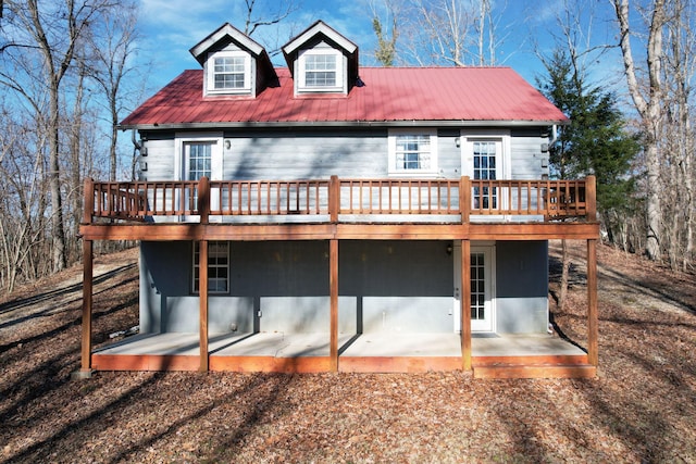 rear view of property with a patio and a deck