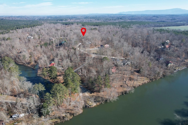 bird's eye view with a water and mountain view