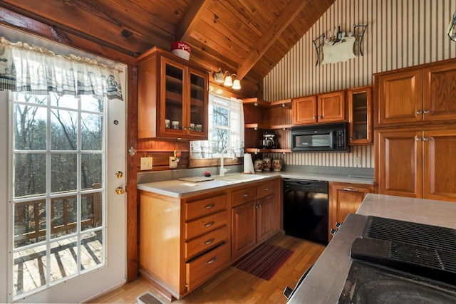 kitchen with black appliances, wood ceiling, vaulted ceiling with beams, sink, and light hardwood / wood-style flooring