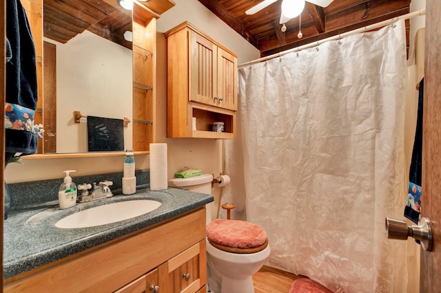 bathroom with wood-type flooring, beam ceiling, wooden ceiling, toilet, and vanity